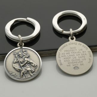 Back view of Antique Finish Sterling Silver 24mm St Christopher Keyring With Travellers Prayer and personalised engraving around the back border in baby script font
